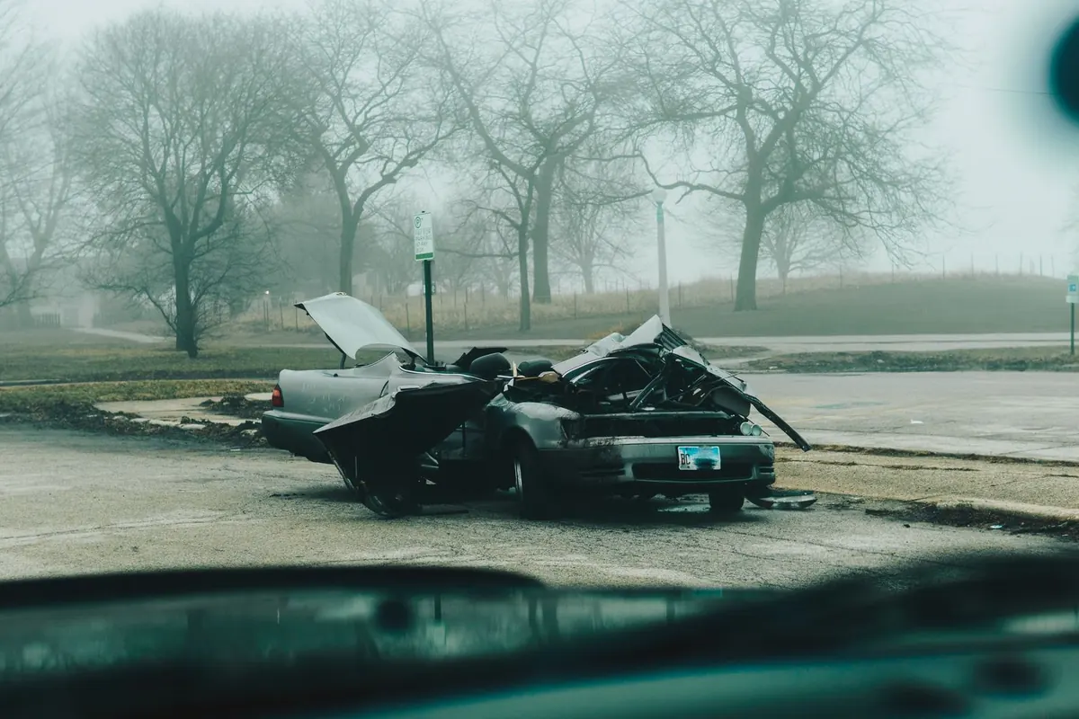 Arlington personal injury lawyer: a wrecked car left on a misty road after a serious collision