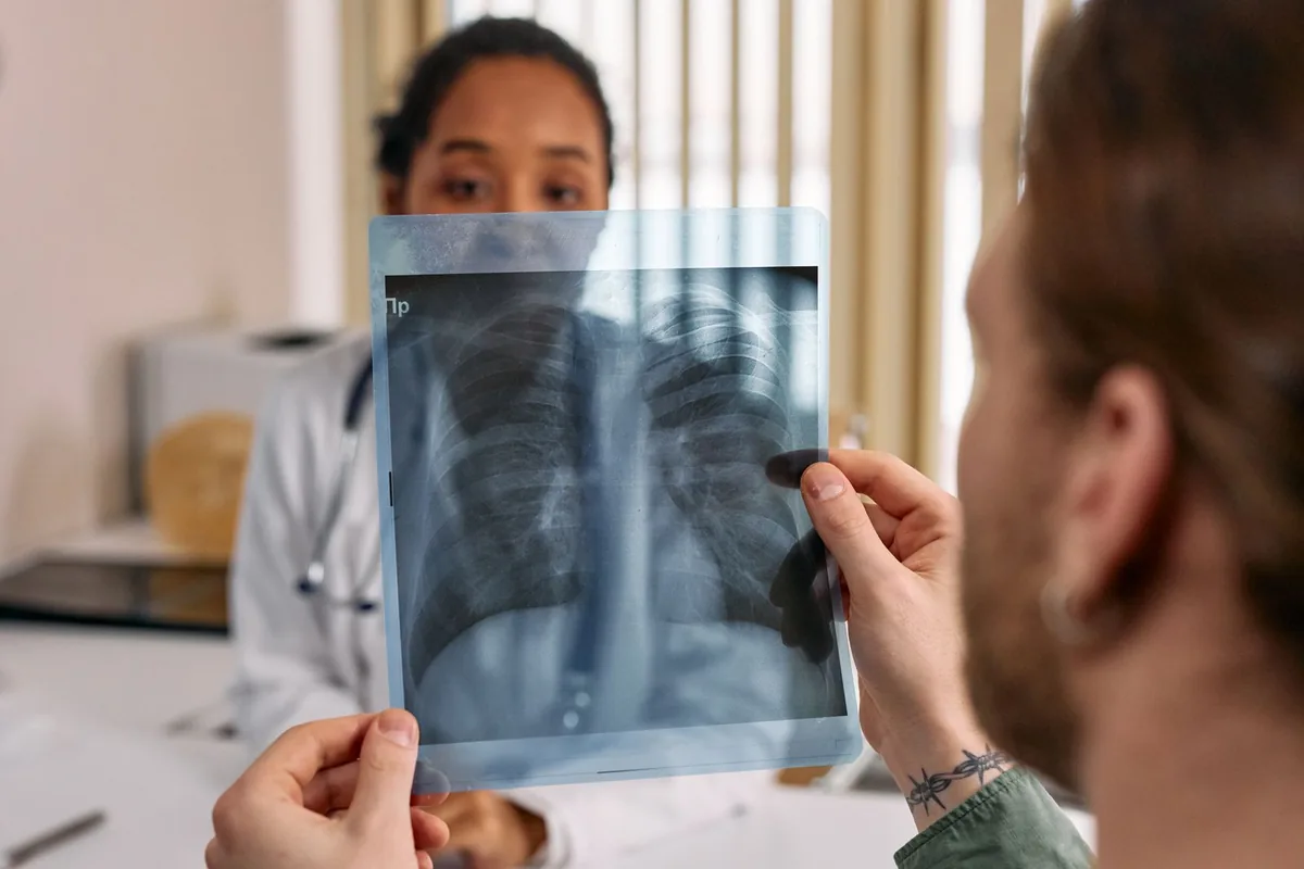 Dallas personal injury lawyer: a doctor and an injured patient reviewing an x-ray together